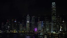 5K stock footage aerial video approach and zoom in on Bank of China Tower on Hong Kong Island at night, China Aerial Stock Footage | SS01_0218
