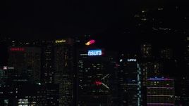 5K stock footage aerial video approach product billboards on high-rise rooftops on Hong Kong Island at night, China Aerial Stock Footage | SS01_0219