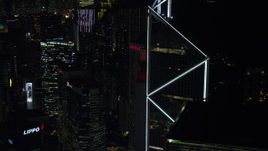 5K stock footage aerial video orbit Bank of China Tower to reveal a pair of high-rises at night on Hong Kong Island, China Aerial Stock Footage | SS01_0227
