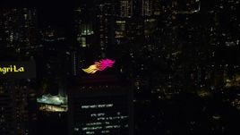 5K stock footage aerial video flyby dragon logo on Hong Kong Island high-rise rooftop at night, China Aerial Stock Footage | SS01_0229