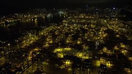 5K stock footage aerial video fly over stacks of containers at the Port of Hong Kong at night, China Aerial Stock Footage | SS01_0234