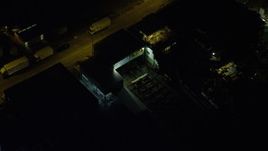 5K stock footage aerial video flyby a dark warehouse at night beside Tsing Yi Island, Hong Kong, China Aerial Stock Footage | SS01_0256