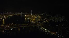 5K stock footage aerial video fly over Rambler Channel at night to approach Stonecutters Bridge and Port of Hong Kong, China Aerial Stock Footage | SS01_0260