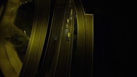 5K stock footage aerial video bird's eye view of cars and trucks on a freeway at night on Lantau Island, Hong Kong, China Aerial Stock Footage | SS01_0270