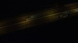 5K stock footage aerial video bird's eye of light freeway traffic at nighttime on Lantau Island, Hong Kong, China Aerial Stock Footage | SS01_0273