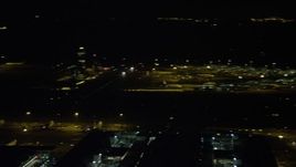 5K stock footage aerial video pan across Hong Kong International Airport at night, China Aerial Stock Footage | SS01_0277