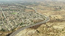 1080 stock footage aerial video follow the 118 freeway to neighborhoods in Simi Valley, California Aerial Stock Footage | TS01_002
