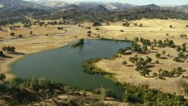 1080 stock footage aerial video fly over lake and waterfront homes near mountains in San Jose, California Aerial Stock Footage | TS01_128