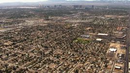 1080 stock footage aerial video tilt from neighborhoods in East Las Vegas to reveal the Las Vegas Strip, Nevada Aerial Stock Footage | TS02_34