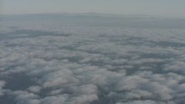 4K stock footage aerial video fly over clouds toward distant mountain ridges in Ventura County, California Aerial Stock Footage | WA001_011