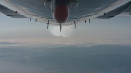 4K stock footage aerial video of a reverse view of the bottom of the plane and the contrail over Los Padres National Forest, California Aerial Stock Footage | WA001_027