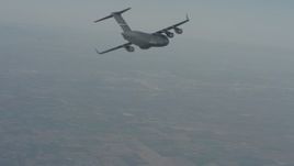 4K stock footage aerial video of a Boeing C-17 in flight over Solano County, California Aerial Stock Footage | WA001_033