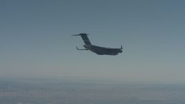 4K stock footage aerial video of a Boeing C-17 flying over Solano County, California Aerial Stock Footage | WA001_042