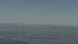 4K stock footage aerial video air-to-air of a jet flying over mountains in the distance, Solano County, California Aerial Stock Footage | WA001_046