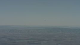 4K stock footage aerial video air-to-air view of a jet over mountains in Solano County, California Aerial Stock Footage | WA001_047