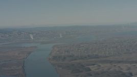 4K stock footage aerial video air-to-air view of a jet flying over Sacramento River and windmills, Solano County, California Aerial Stock Footage | WA001_048