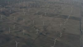 4K stock footage aerial video of passing a field of windmills in Solano County, California Aerial Stock Footage | WA001_052