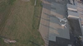4K stock footage aerial video of a view of the runway as a Lear jet takes off from Van Nuys Airport, California Aerial Stock Footage | WA002_001