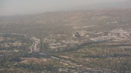 4K stock footage aerial video pan across hillside homes and suburban neighborhoods in Woodland Hills, California Aerial Stock Footage | WA002_002