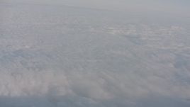4K stock footage aerial video tilt from a bird's eye view of dense cloud cover over Southern California Aerial Stock Footage | WA002_014