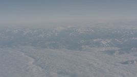 4K stock footage aerial video of clouds around snowy Sierra Nevada Mountains, California Aerial Stock Footage | WA002_032