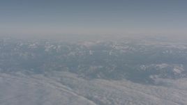 4K stock footage aerial video of a layer of clouds around the Sierra Nevada Mountains, California Aerial Stock Footage | WA002_035