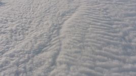 4K stock footage aerial video of a reverse view of rippled white clouds over the Central Valley, California Aerial Stock Footage | WA002_045