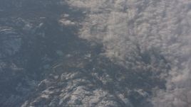 4K stock footage aerial video of a bird's eye view of clouds beside the Sierra Nevada Mountains, California Aerial Stock Footage | WA002_046