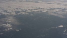 4K stock footage aerial video of the Sierra Nevada Mountains and clouds rolling over them, California Aerial Stock Footage | WA002_049
