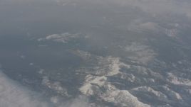 4K stock footage aerial video of snowy mountains beside Lake Tahoe, California Aerial Stock Footage | WA002_073