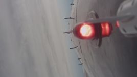 4K stock footage aerial video of the underside of a jet flying over dense clouds, Lassen County, California Aerial Stock Footage | WA004_007