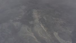 4K stock footage aerial video bird's eye view of snowy mountain ridge and misty clouds in Lassen County, California Aerial Stock Footage | WA004_008