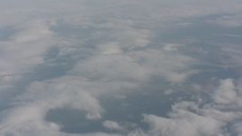 4K stock footage aerial video tilt from dense cover of clouds over Lake County, Oregon Aerial Stock Footage | WA004_026