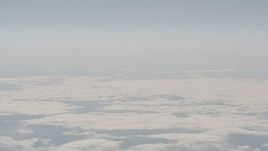 4K stock footage aerial video track a jet airplane flying over cloud cover in Lake County, Oregon Aerial Stock Footage | WA004_027
