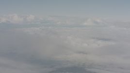 4K stock footage aerial video of flying through mist to reveal white cloud cover over Lake County, Oregon Aerial Stock Footage | WA004_031