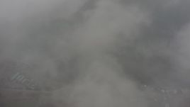 4K stock footage aerial video of a bird's eye view of Puget Sound seen while flying through misty clouds, Washington Aerial Stock Footage | WA004_042
