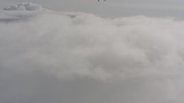 4K stock footage aerial video fly low over clouds above Washington Aerial Stock Footage | WA004_051