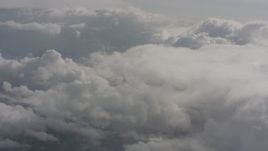4K stock footage aerial video fly through misty clouds toward more clouds over Washington Aerial Stock Footage | WA004_052