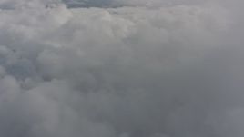 4K stock footage aerial video of flying over a wide expanse of clouds over Washington Aerial Stock Footage | WA004_072