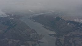 4K stock footage aerial video of following the Columbia River between mountains on the border of Washington and Oregon Aerial Stock Footage | WA004_097