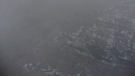 4K stock footage aerial video of a bird's eye view of snowy wilderness below misty clouds in Oregon Aerial Stock Footage | WA004_098