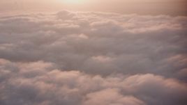 4K stock footage aerial video flyby sunset-lit clouds over Southern California Aerial Stock Footage | WA005_006