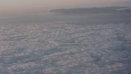 4K stock footage aerial video pan across cloud layer surrounding mountains at sunset in Southern California Aerial Stock Footage | WA005_008