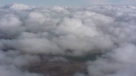 4K stock footage aerial video flyby a wide expanse of clouds over Southern California Aerial Stock Footage | WA005_020