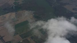 4K stock footage aerial video of a bird's eye view of a cloud over Ohio farmland, tilt to reveal a lake Aerial Stock Footage | WA005_064