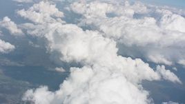 4K stock footage aerial video tilt from a cloud over Ohio to larger formations in the background Aerial Stock Footage | WA005_081