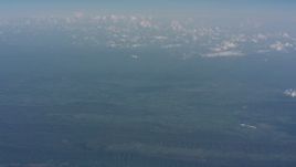 4K stock footage aerial video approach a cloud above West Virginia, and tilt up to a wider view of mountains and countryside Aerial Stock Footage | WA005_090