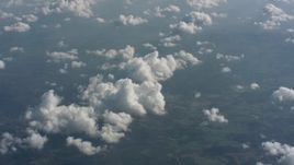 4K stock footage aerial video of a view of partly cloudy skies above West Virginia, tilt to a cloud formation Aerial Stock Footage | WA005_098