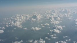 4K stock footage aerial video tilt from clouds over countryside to a wider view of cloud cover over West Virginia Aerial Stock Footage | WA005_099