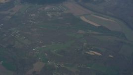 4K stock footage aerial video of tilting from a bird's eye of farm fields to reveal clouds above Virginia Aerial Stock Footage | WA006_004